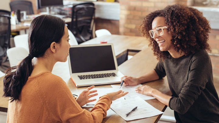 Two women at laptop