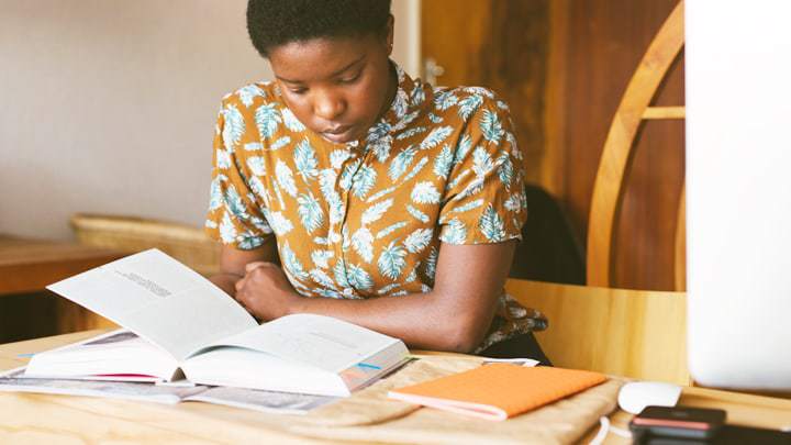 Woman reading text book