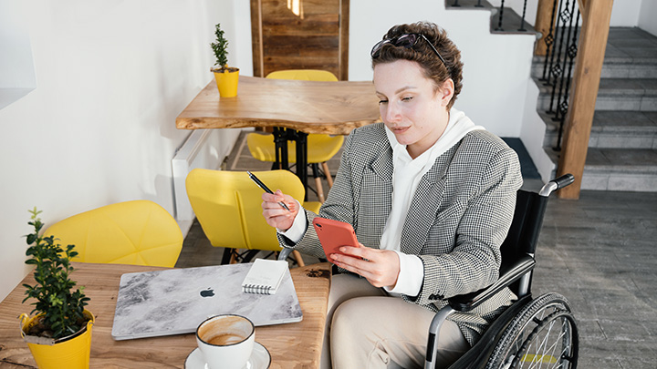 Woman in wheelchair studying