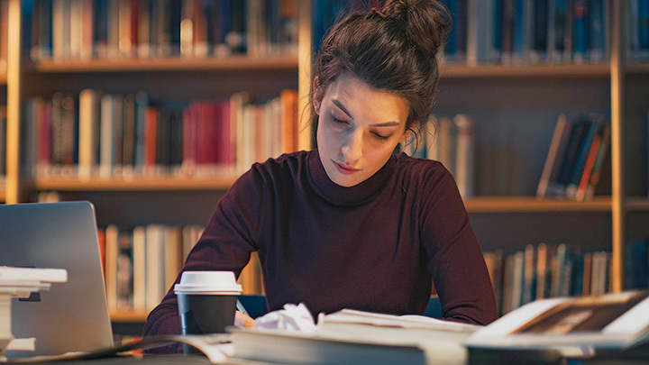 Woman at desk reading