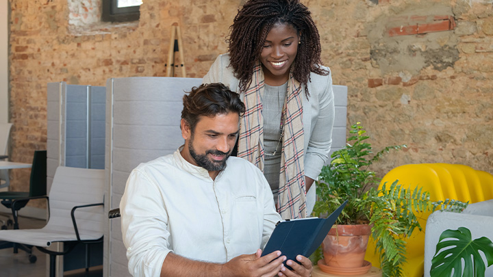 Man and woman looking at tablet