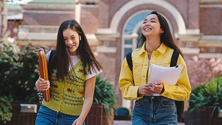 Two young women laughing