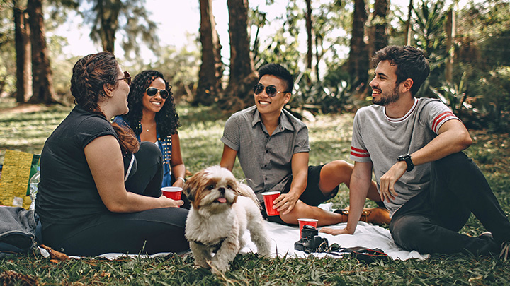 Group sat in woods with dog