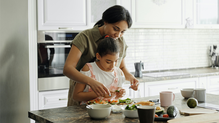 Woman and child cooking