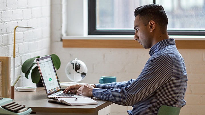 Man at laptop on desk