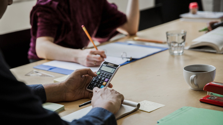 Man using a calculator