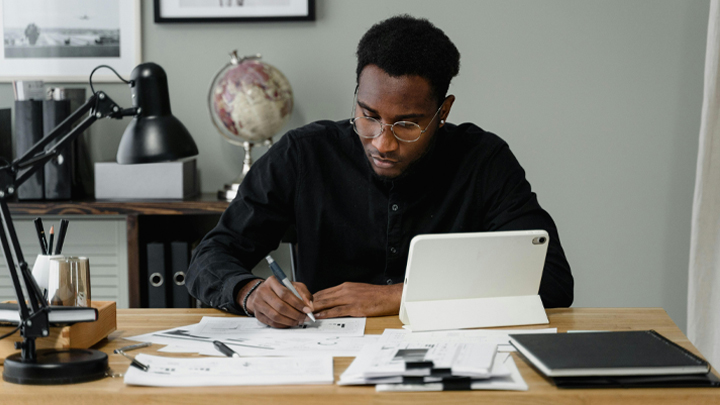 Man working on tablet at desk