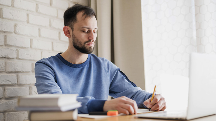 man working at laptop